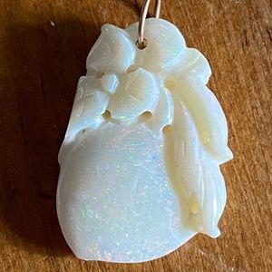 Carved opal pendant